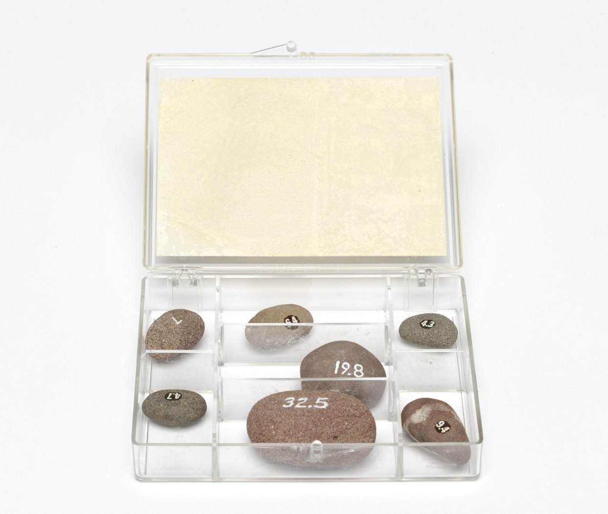 Case open, revealing rocks within.
