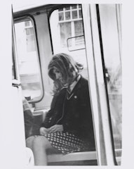 Kristine Stiles, dressed as Roberta Breitmore, on a bus in San Francisco