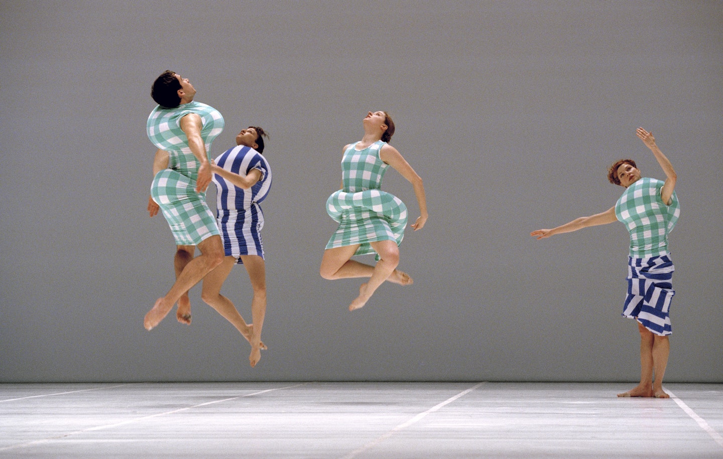 Photograph from Scenario (1997) taken by Jacques Moatti at the Opéra National de Paris in January 1998 featuring the costumes of Rei Kawakubo.  Dancers from L-R: Tom Caley, Banu Ogan, Jeannie Steele, and Lisa Boudreau.