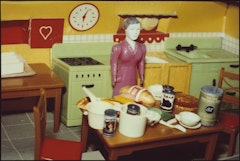 Woman/Purple Dress/Kitchen