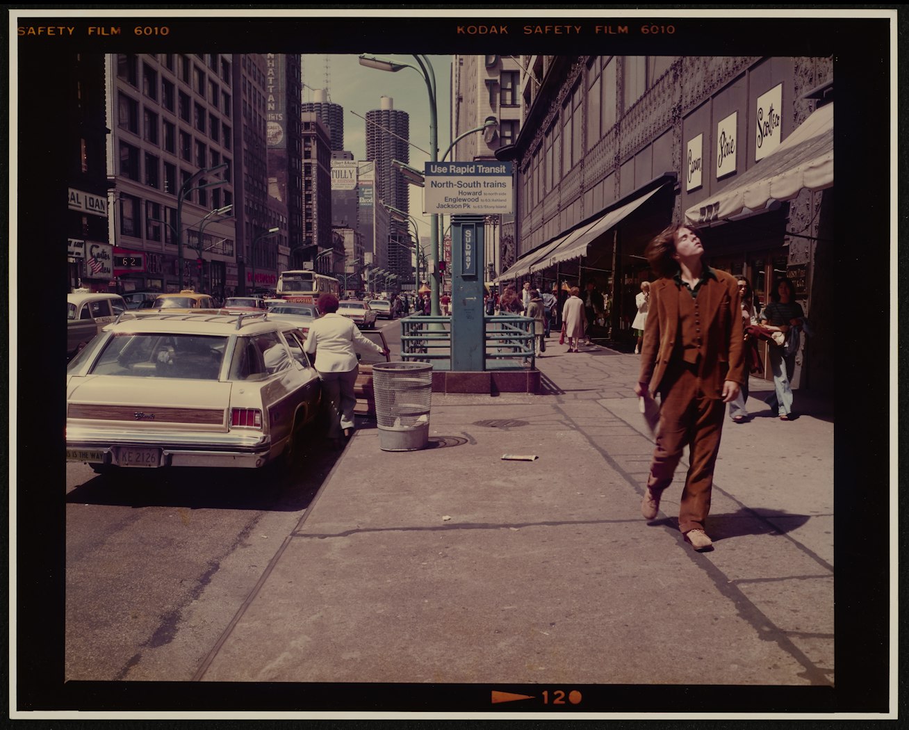 (Guy flipping his hair, State Street, Chicago)