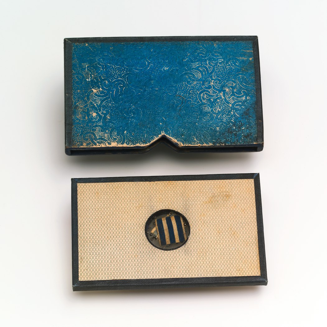 Object & slipcase together, shot from above.