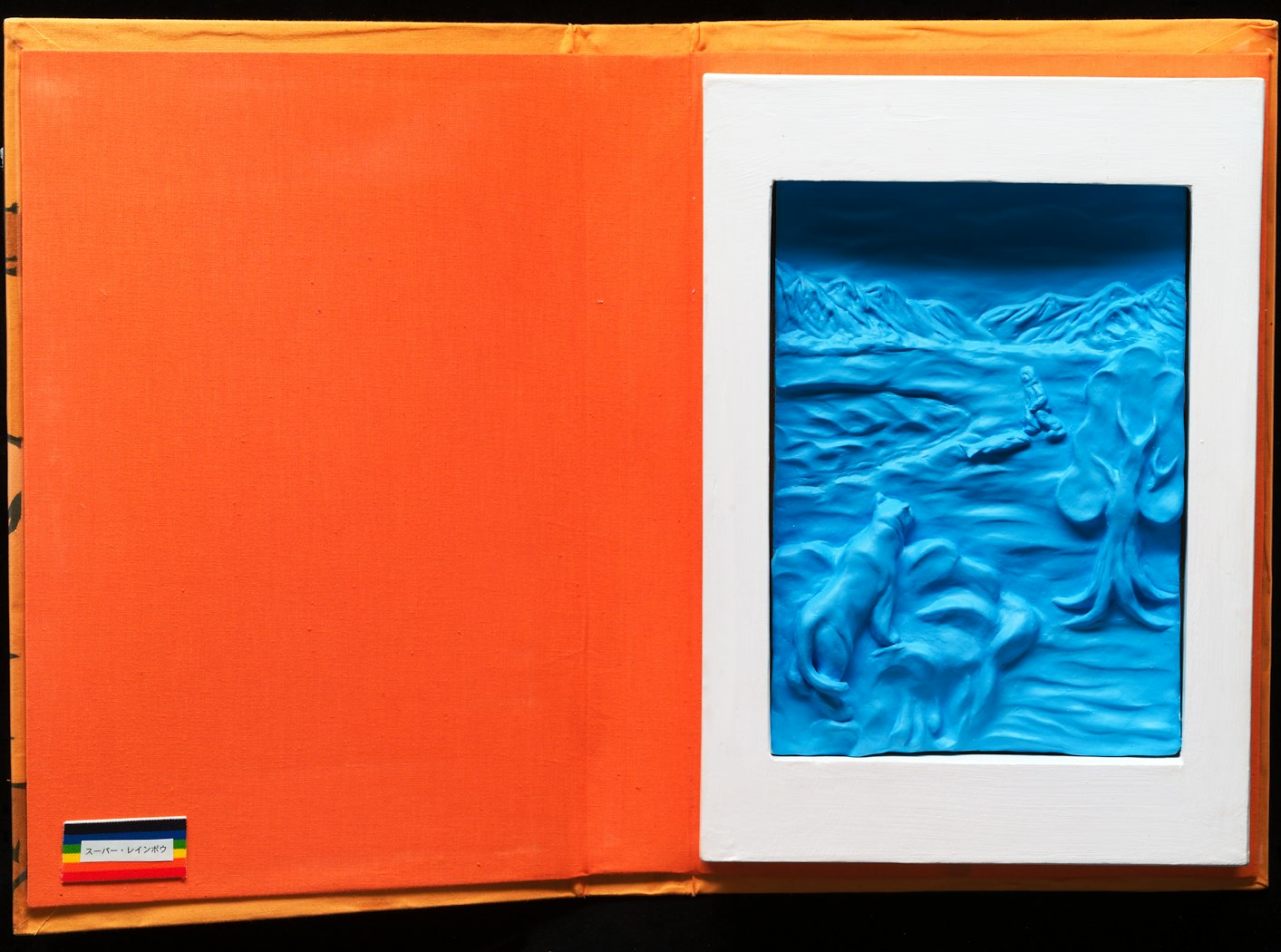 2002.62.2 Inside of book - sculpted work